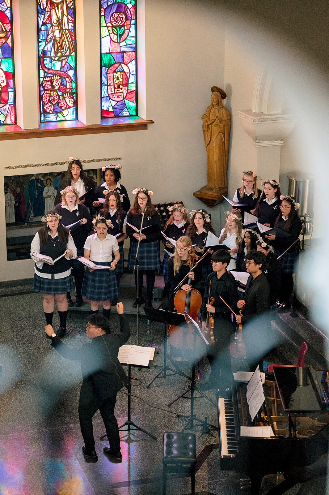 A group of St. Mary's Academy students perform on stage at the school's annual spring concert.